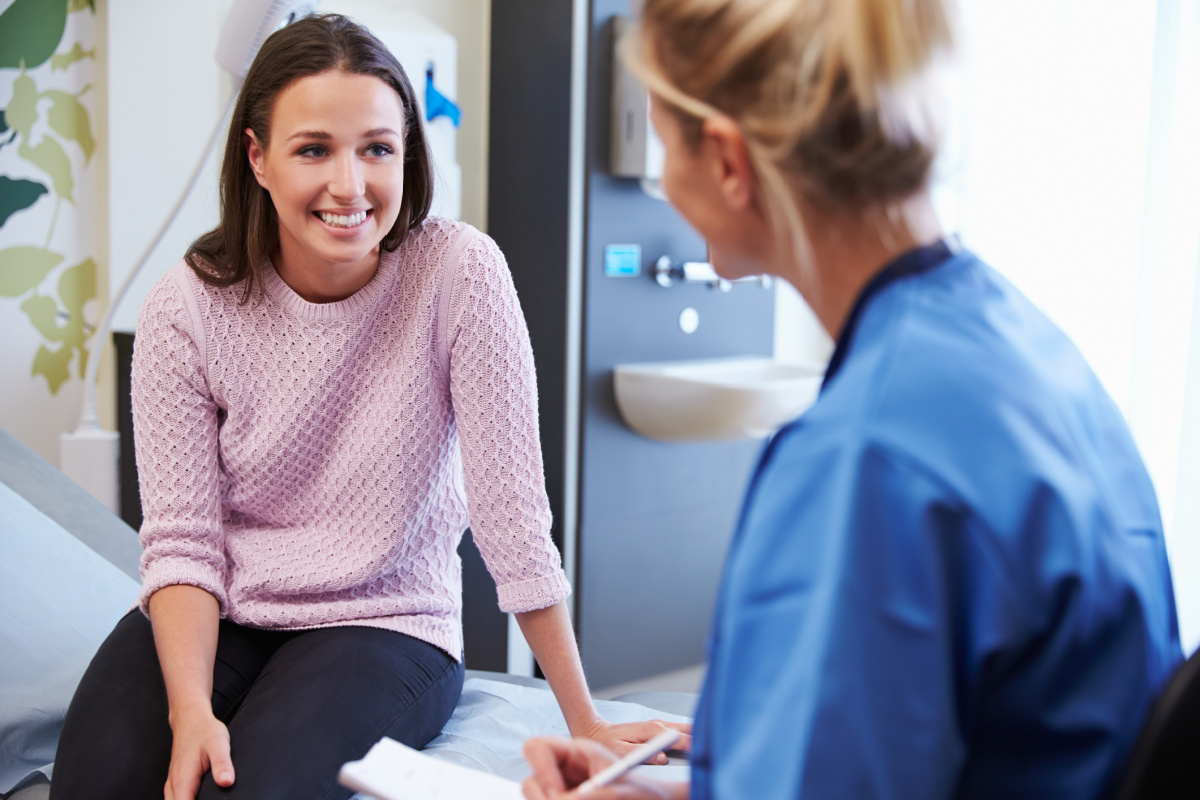 Woman during a consultation with her plastic surgeon discussing rapid recovery options